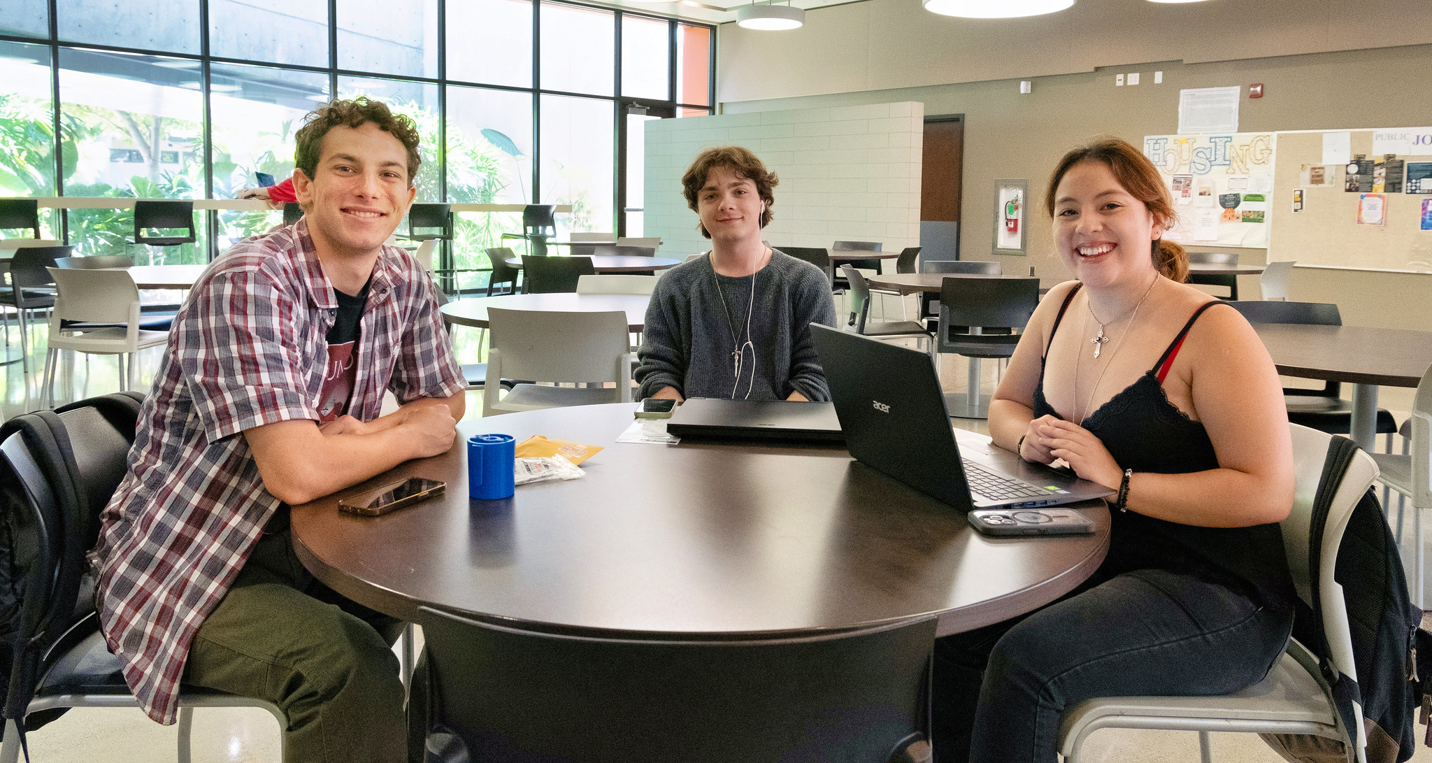Three Miramar students sitting at a table