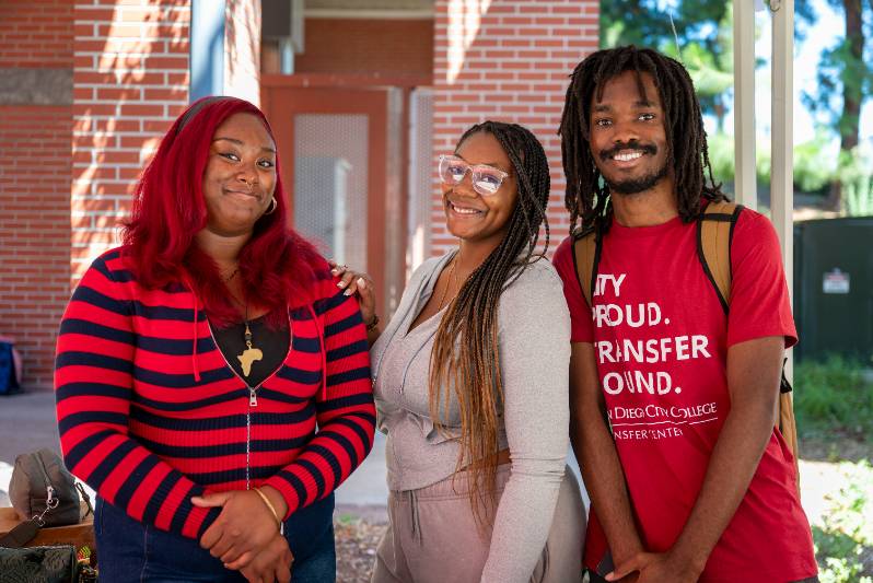 Three students outside on campus