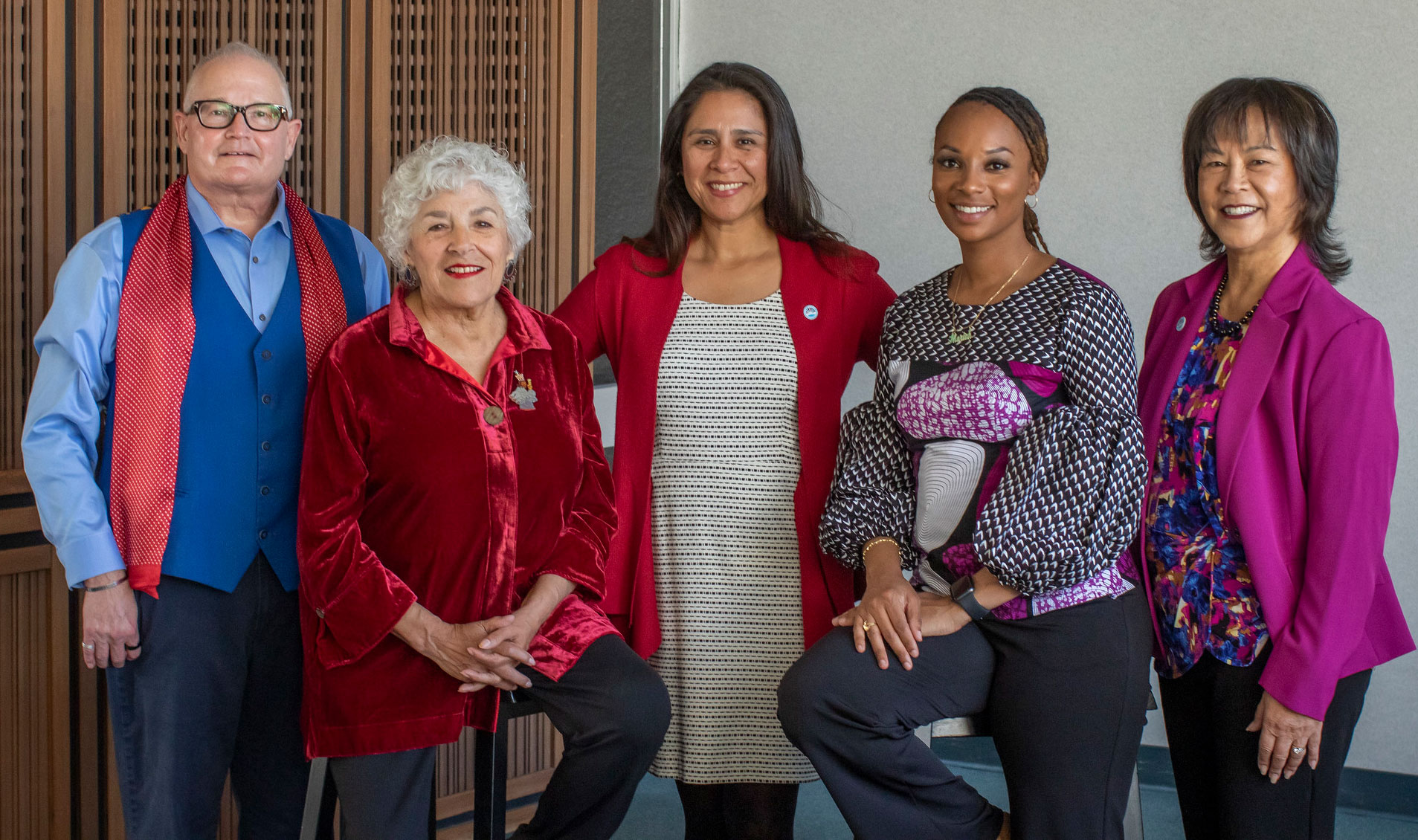 All five trustees in the lobby of the district office.