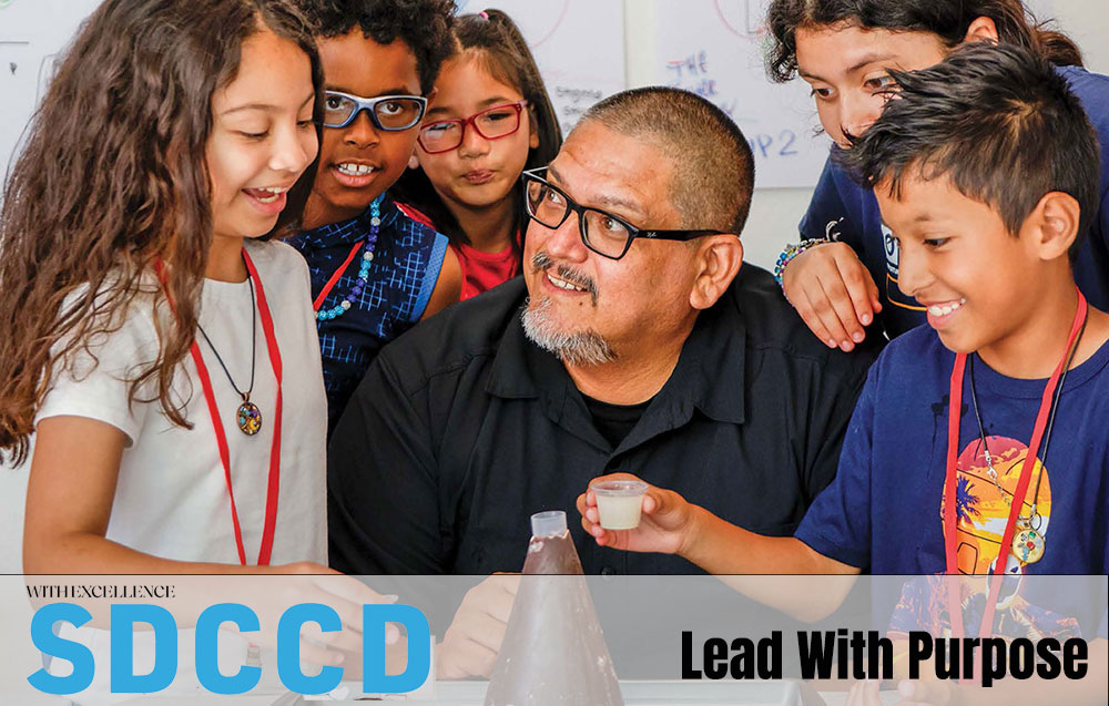 Cover of WE Magazine shows Beto Vasquez working on a volcano science project with five kids