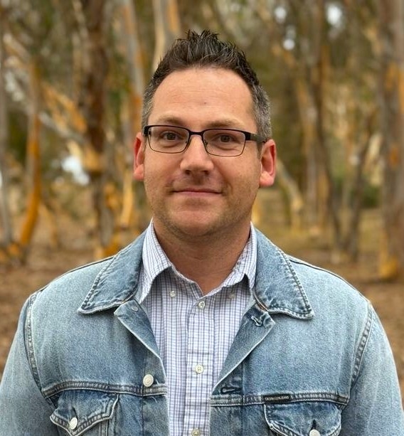 Caleb Mertz-Vega caleb mertz-vega glasses striped collared shirt jean jacket
