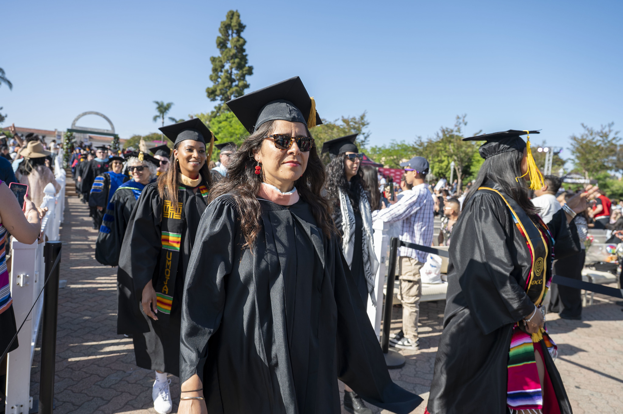 
Trustee Geysil Arroyo walking toward the stage.
