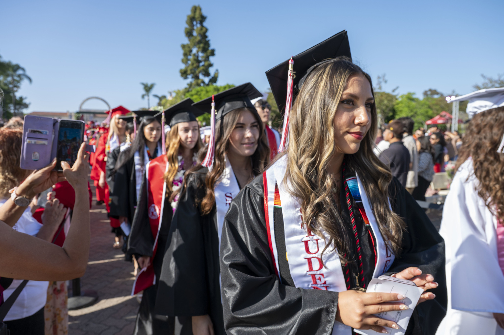 
Graduates line up to receive their diplomas.
