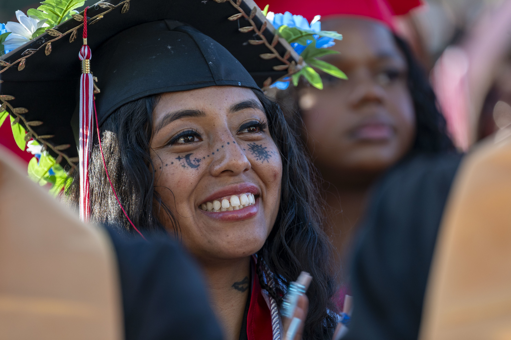 
A graduate smiling in the audience.
