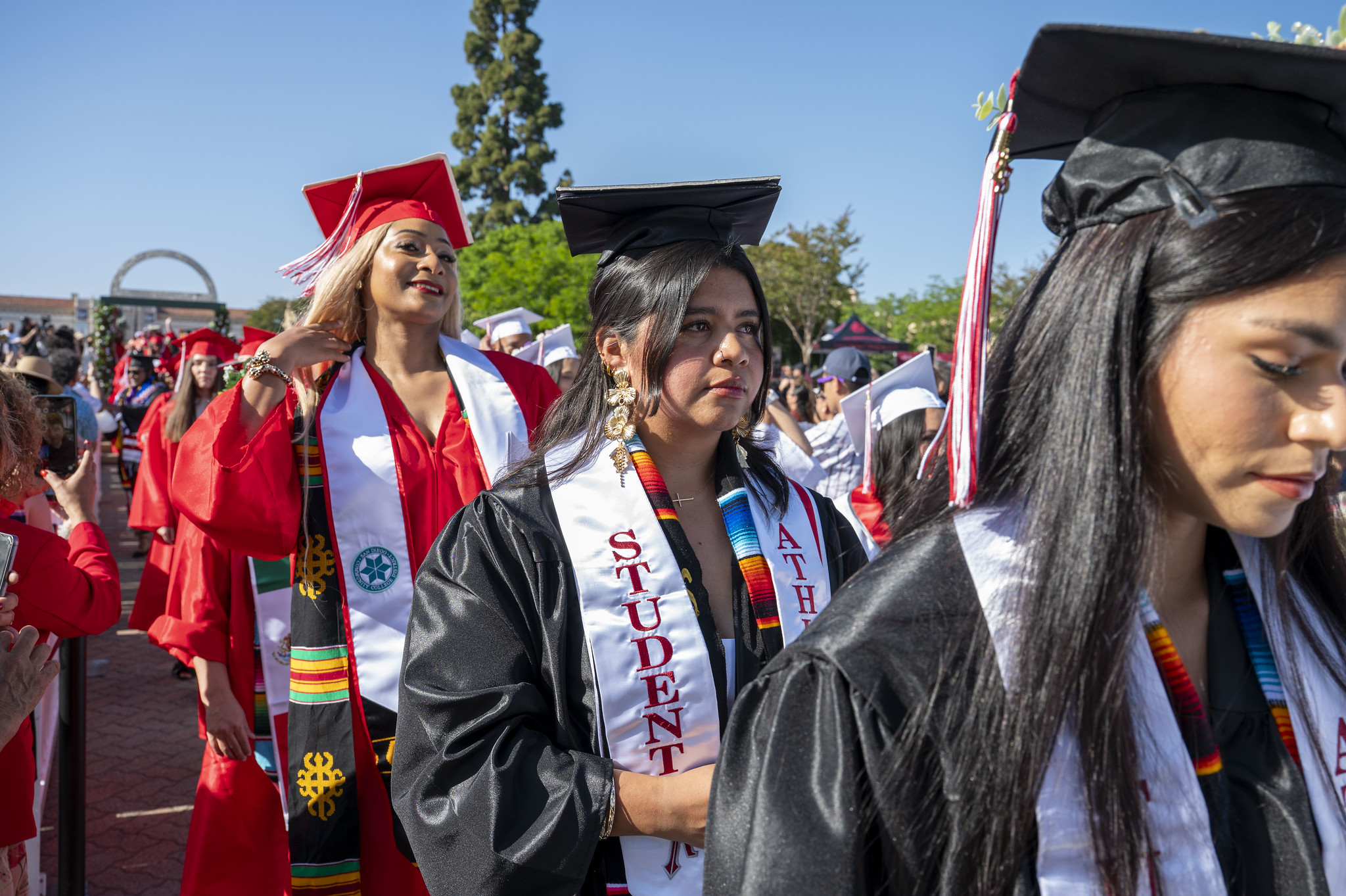 
Two lines of graduates enter the ceremony.
