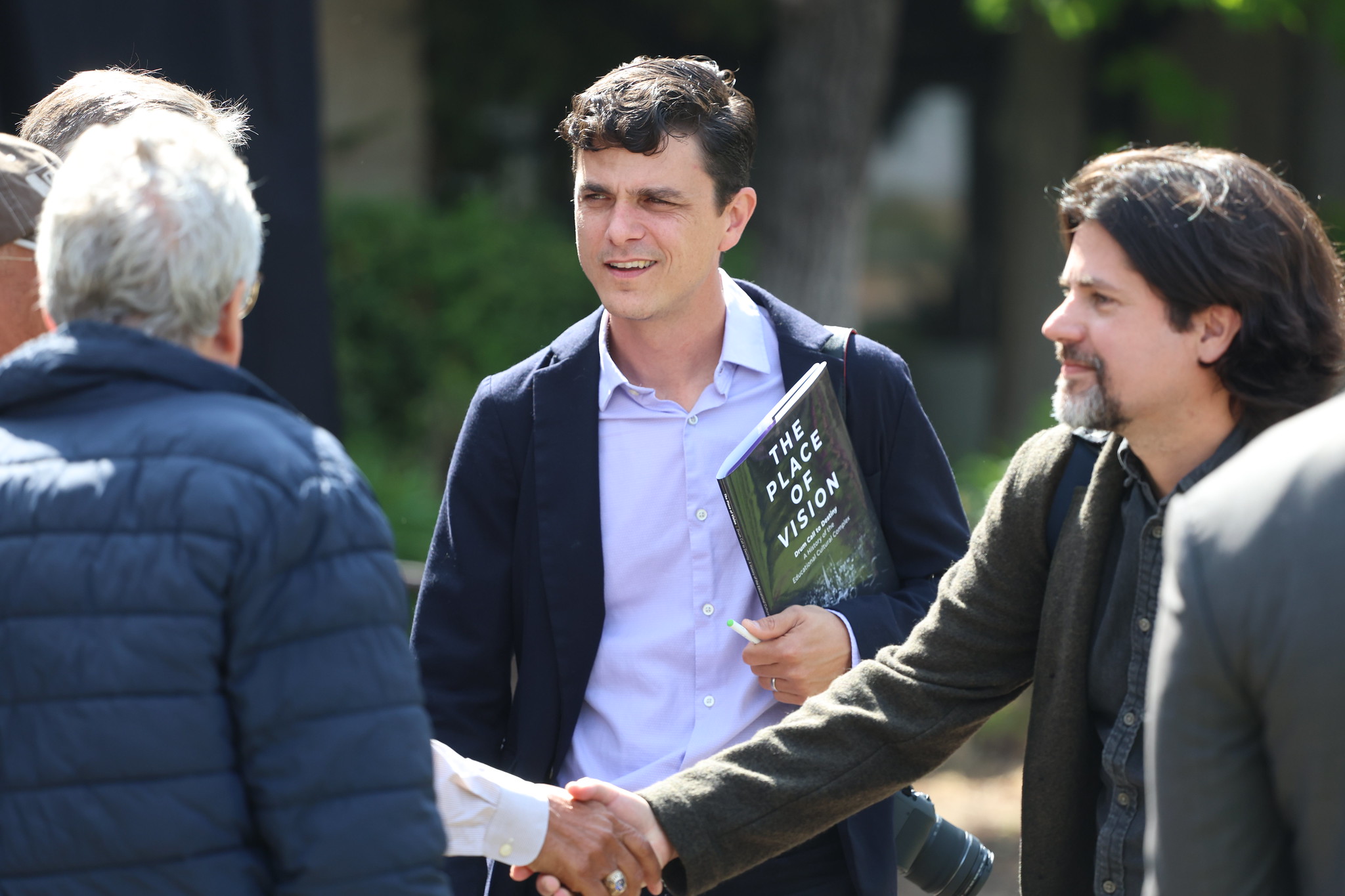 
Attendees chatting at the event.
