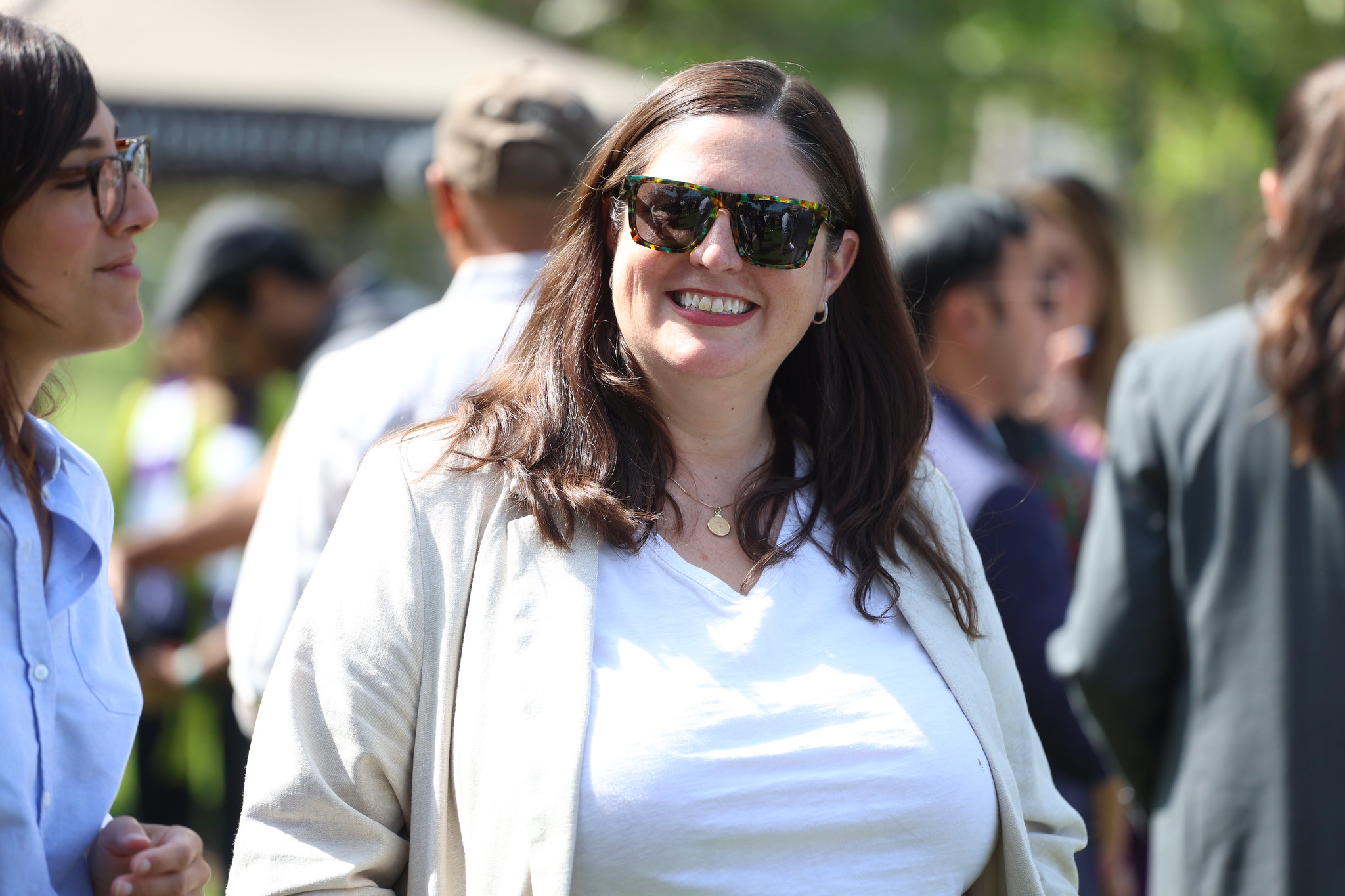 
An attendee smiling at the groundbreaking.

