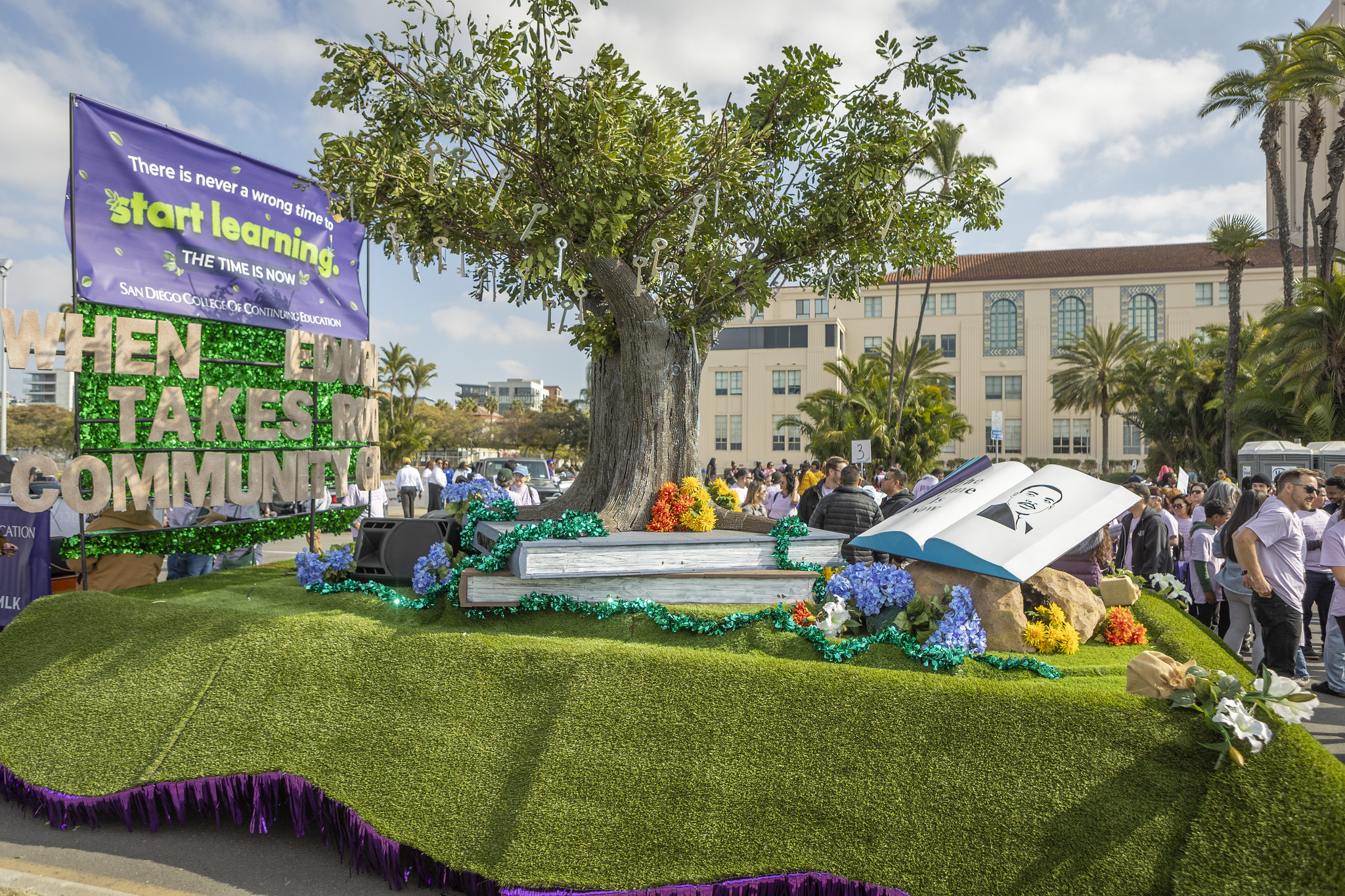 Our parade float features a tree of life and a rotating book with MLK's picture.