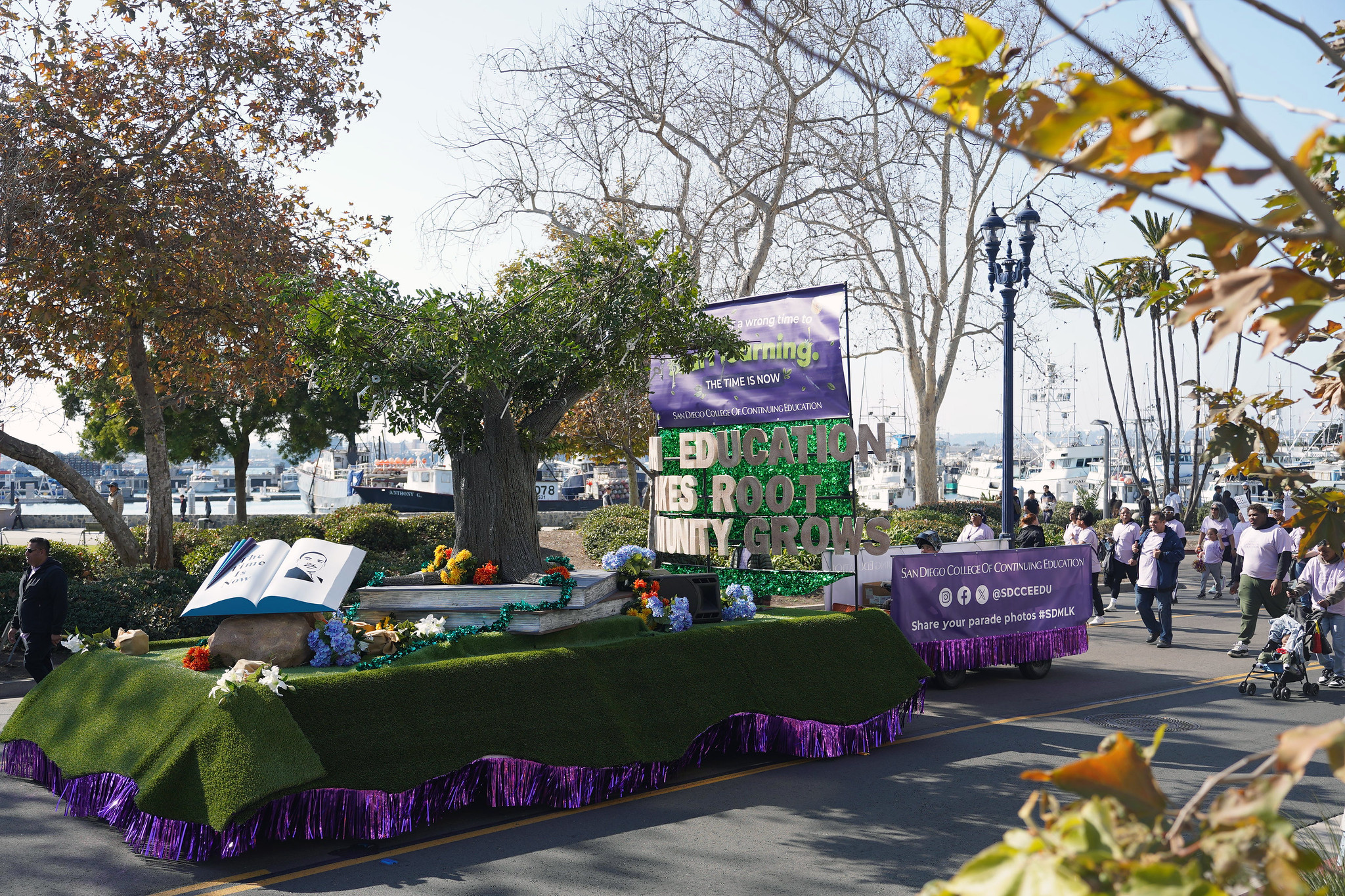 Our parade float features a tree of life and a rotating book with MLK's picture.