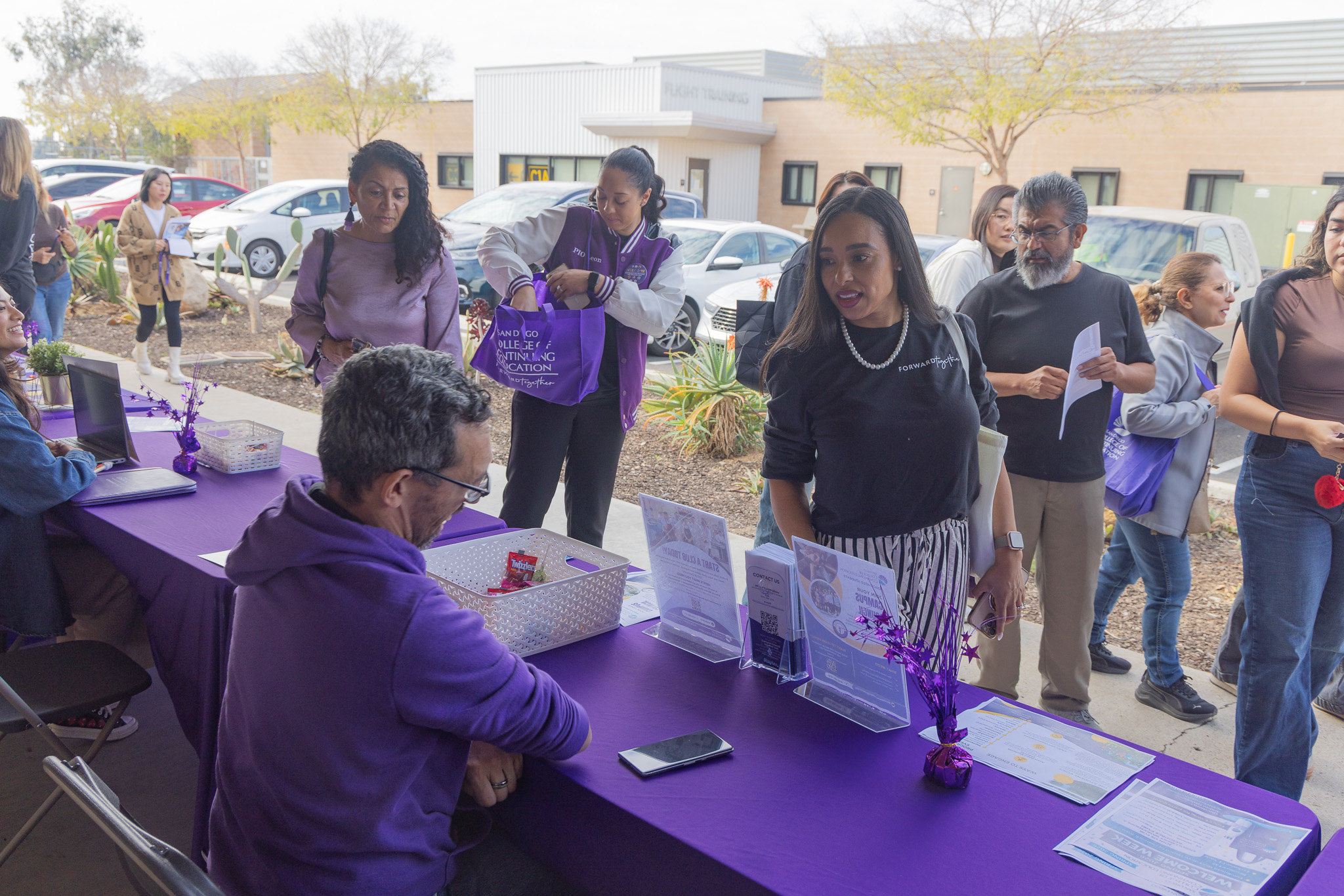 
College of Continuing Education President Tina King stops by a welcome table.
