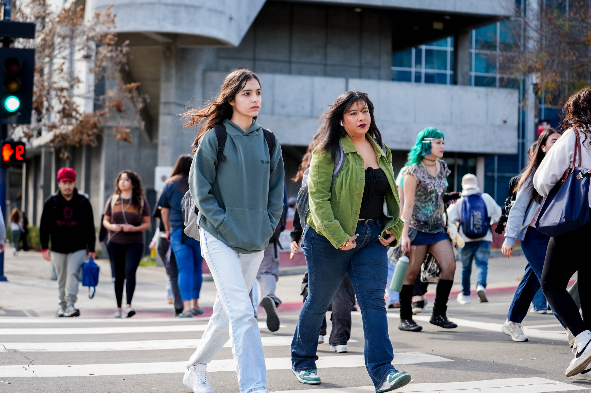 
Several students cross the crosswalk at City College.
